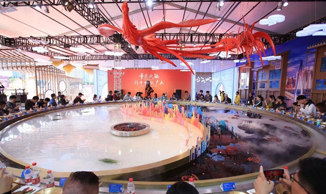 In pics: extra large hotpot at exhibition area of 2nd CIIE