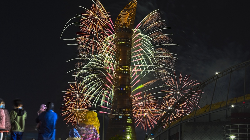 People watch fireworks on eve of Qatar National Day in Doha