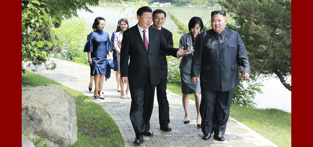 习近平会见朝鲜劳动党委员长、国务委员会委员长金正恩